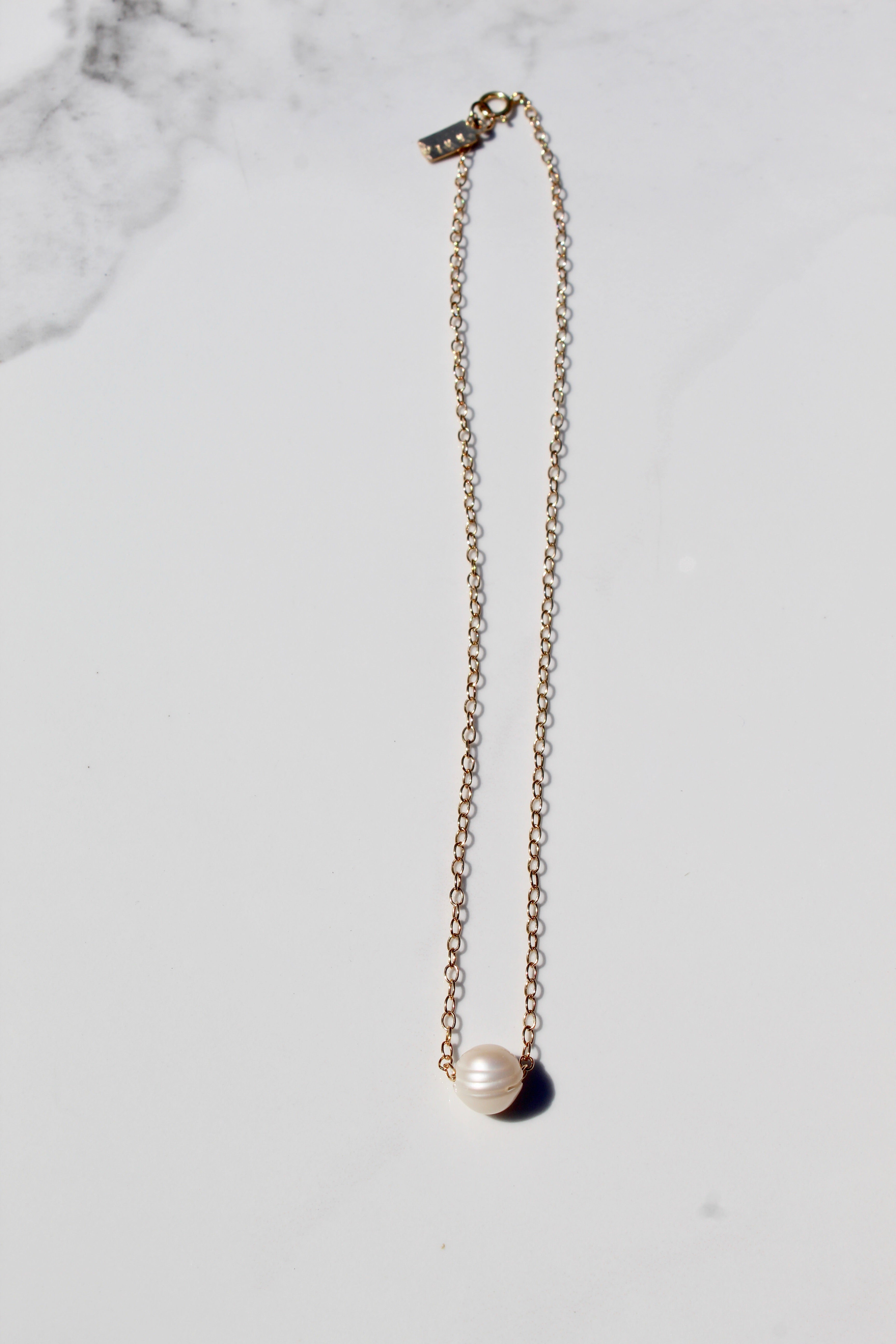 Floating pearl necklace